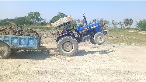 Trakstar Tractor over loading soil using JCB 3 DX backhoe machine after Tractor stuck