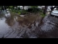 Localized street flooding in Somerville, MA 07/12/2017 - Clearing the storm drains of debris