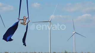 Aerial Silks Athlete, Woman Is Doing A Split Between Two Strings Of Fabric Stock Footage - Env...