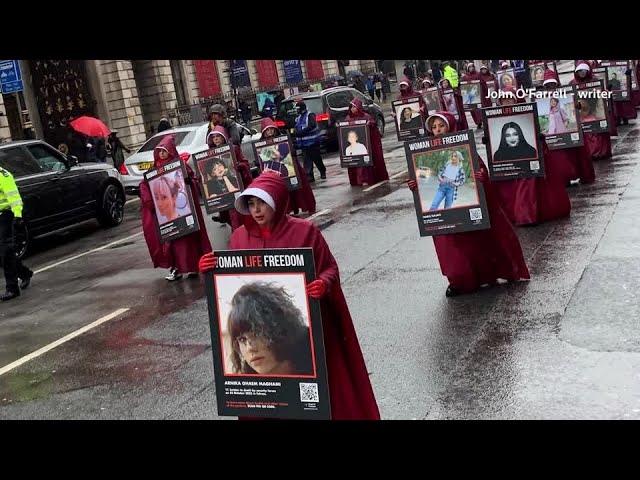 ⁣'Handmaids' rally in London for Iranian women