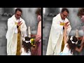 A girl high fives a priest