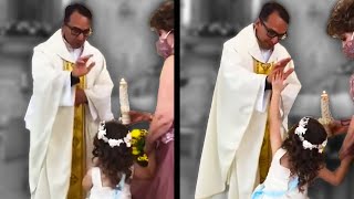 A Girl High Fives a Priest