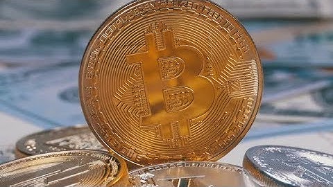 Gold Bitcoin Coin, BTC and Bills of Dollars Are Rotating | Stock Footage - Videohive