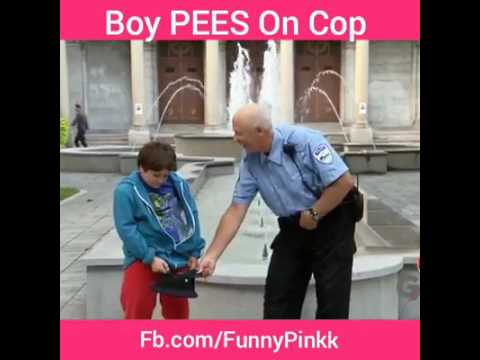 Boy  PEES on cop