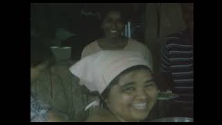 early Jonestown members enjoying a meal together (1975) in Guyana