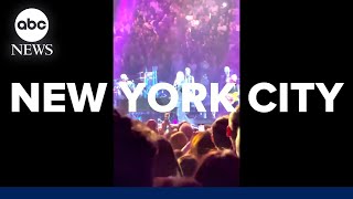 Billy Joel performs 'Uptown Girl' while Christie Brinkley is seen in audience