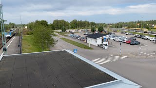 Vy från gångbro över Öxnered station med tåg - View from pedestrial bridge in Sweden with two trains