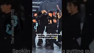 Seokjin and Taehyung putting gun on eo’s heads then Taehyung adjusting Jin’s in ear wire😅#taejin#bts