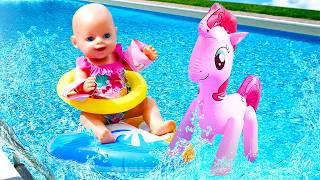 The doll and the nanny are swimming and playing with toys in the pool. screenshot 5
