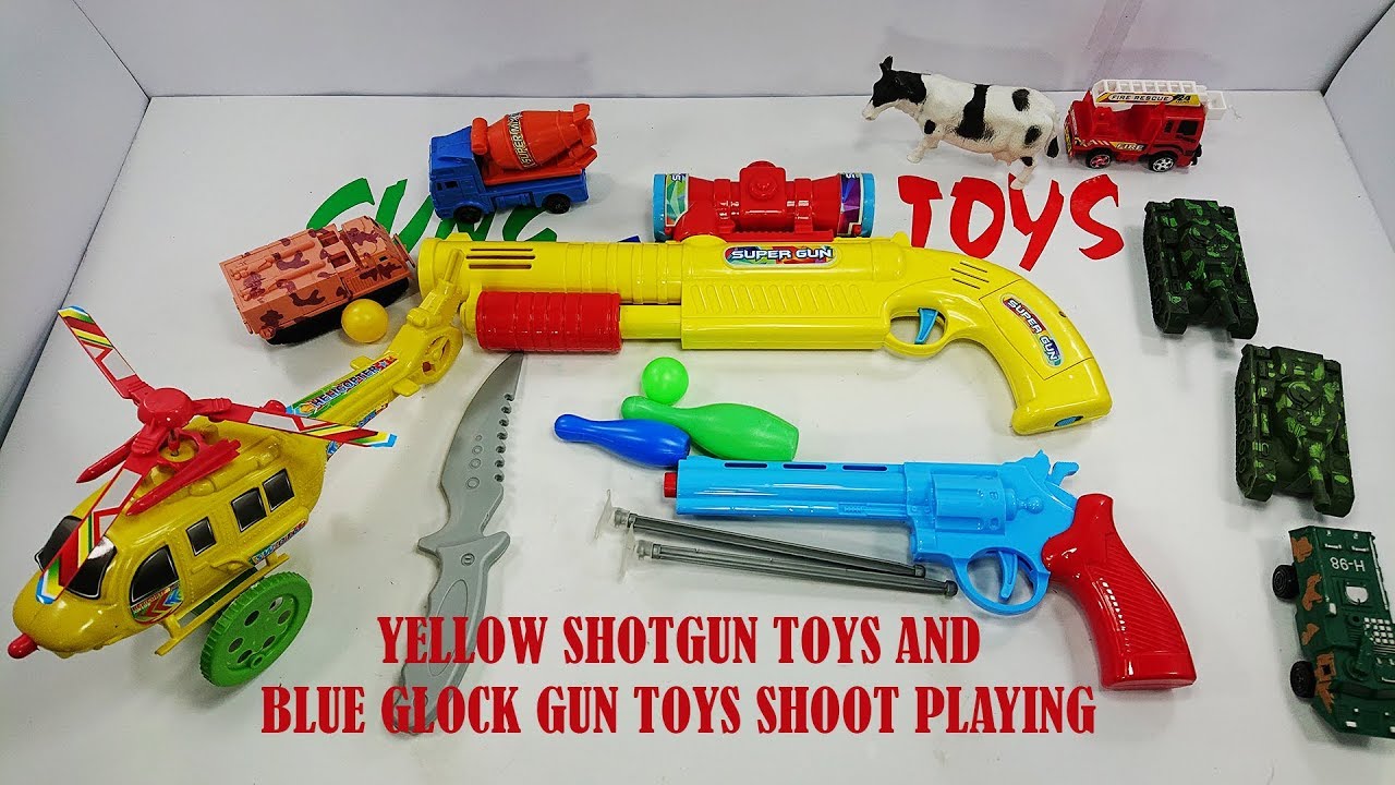 Yellow Shotgun Toys And Blue Glock Toys Shoot Playing - Colored Gun ...