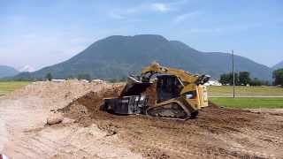 Cat 289C2 loading dumping hopper