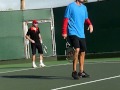 Michael Johns playing an exhibition doubles tennis game at the Grand Slam Jam 10/23/10