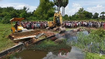 Road Construction Bulldozer on the Brink Clearing the road and pouring soil for the road Push House