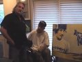 Danny Magoo Chandler receives painting by Kelly Telfer at Brad Lackey's home