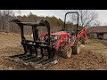 E18 - Aftermarket grapple bucket on the RK24 tractor