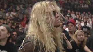 Christian emerges from the crowd to distract Edge