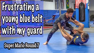 Frustrating a young blue belt with my guard
