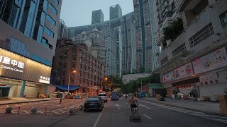 [4K] Laborers under modern tall buildings. The busy street below Chongqing Raffles