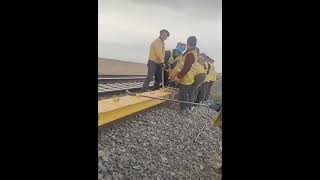 Hardworking skilled workers installing railway this way