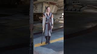 Celebrity Rey pointing to the secret "miniature Millenium Falcon" hidden in the Millenium Falcon. Wealth