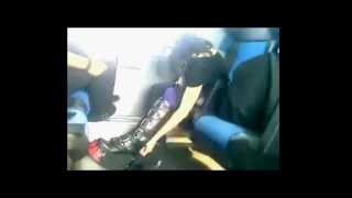 Goth girl putting on her boots