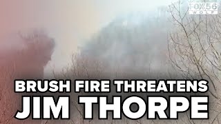 Crews continue to battle fire along Bear Mountain