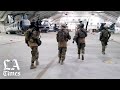 Taliban fighters enter what was the U.S.-controlled portion of the Kabul airport.
