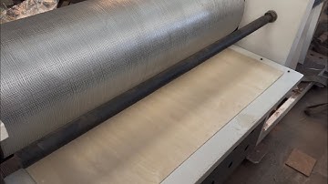 1300 single-sided heavy embossing machine presses deep lines on wood veneer.