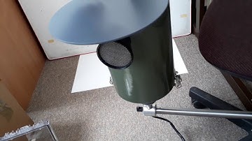 Burkard High-volume Cyclone: Placing the weather-proof cover over the device