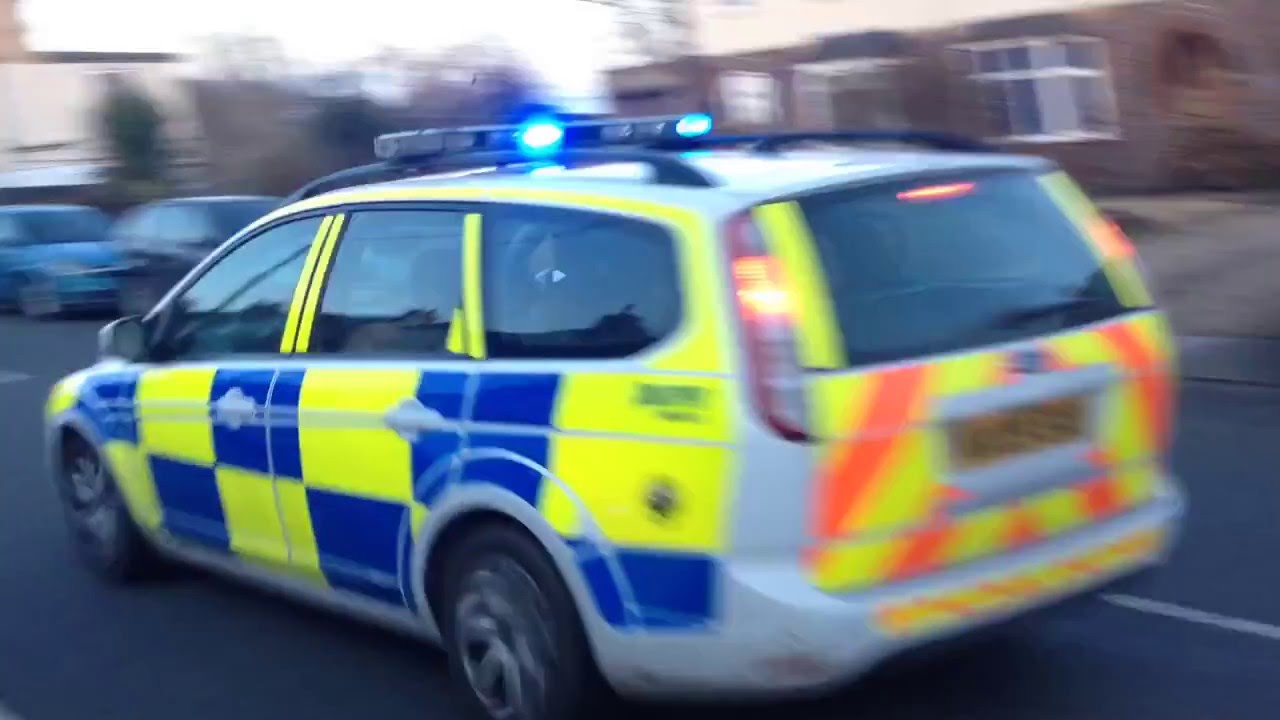 2 X Avon And Somerset Police Ford Focus Estates Responding with Blue