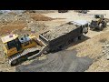 Amazing bulldozer use his power to pushing recovery dump truck stuck mud and wheel loader pulling