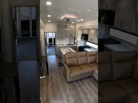 Beautiful travel trailer with built in toy hauler, and elevated patio ￼