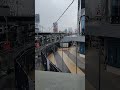 stazione ferroviaria elevata di Manila-Cubao in Filippinene cu una intersezione di duie lineeMRT+LRT