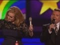 Adele gives the middle finger after being cut off by James Corden at The Brits