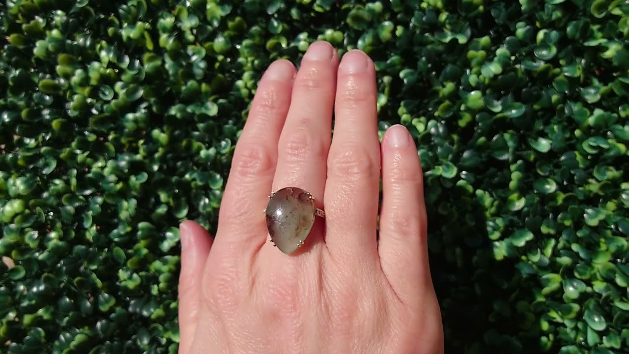 A pear shaped Moss Agate dress ring
