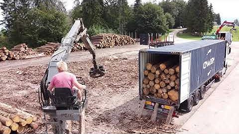 Loading logs into container! Easy job by Jernej & Menso from Slovenian Company ETOS PIC d.o.o.