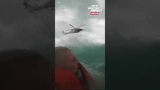 Coast Guard rescues man dog from sailboat right before hits