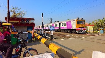 In a Busy rail gate EMU local train crosses very high speed | dangerous skip | East Indian Train 😯