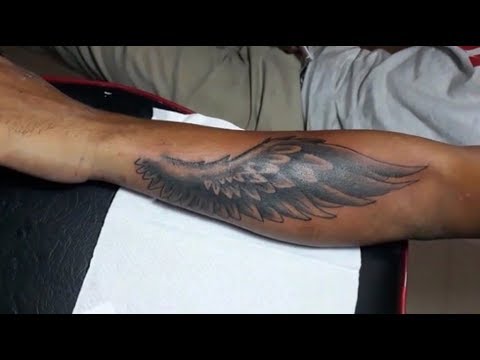 wing tattoo forearm