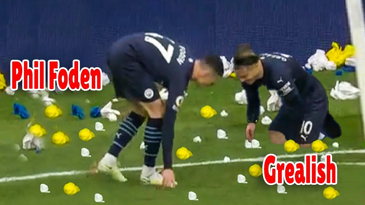 Grealish and Phil Foden pick up paper - Leeds fans throwing paper!