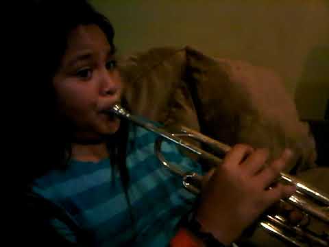 Zion playing the trumpet at home age 12.  Delevan elementary school.