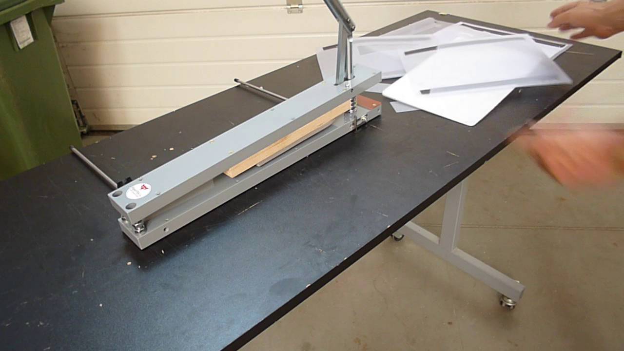 Punching a plastic folder with a Paperfox KB-32 die cutter