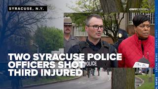 Two officers 'in good spirits' after being shot trying to apprehend machete- wielding suspect Two officers 'in good spirits' after being shot trying to apprehend machete- wielding suspect