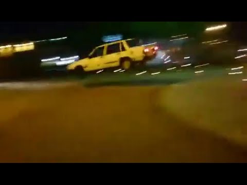 Volvo 740 jumps over roundabout