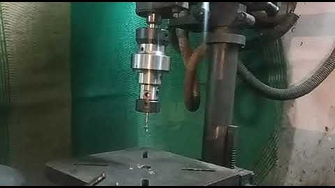 Mounting and Adjustment of Torque of a Tapping Attachment