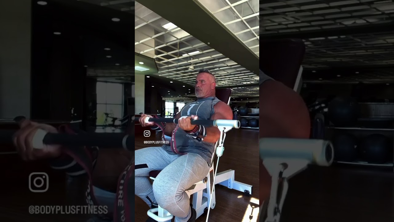 Seated cable barbell curls on an incline bench are a great way to isolate the biceps for maximum