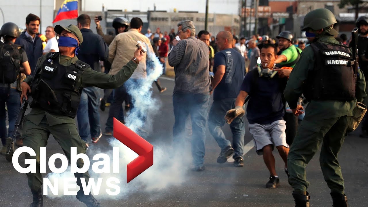 Tear gas fired at Venezuela's Guaido as supporters join uprising against Maduro carcase