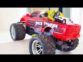 RED monster truck transports toy cars Hot Wheels. COOL jumping monster truck