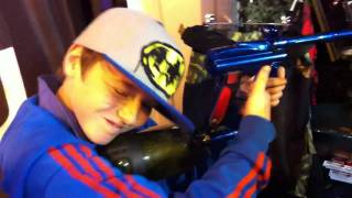 Member of ORIGIN paintball team try out gun