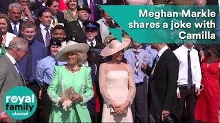 Meghan shares a joke with Camilla at Prince Charle's 70th birthday at Buckingham Palace